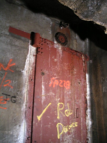 bfs_windtunneldoor2.jpg - The iron door at the end of the wind tunnel, the tunnel is part of the MOD section, but the wall it is in paralles the train tunnel, could it just be a service door?