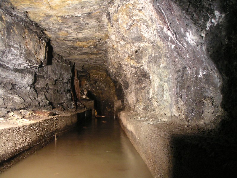 bs_pass_to_waterwheel3.jpg - The concrete lined part of the Rampgill Deep level leading to the water wheel from the generator.