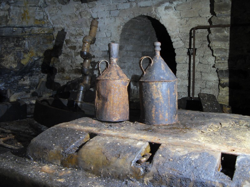35_bs_metal_jugs.jpg - Oil cans with stoppers.
