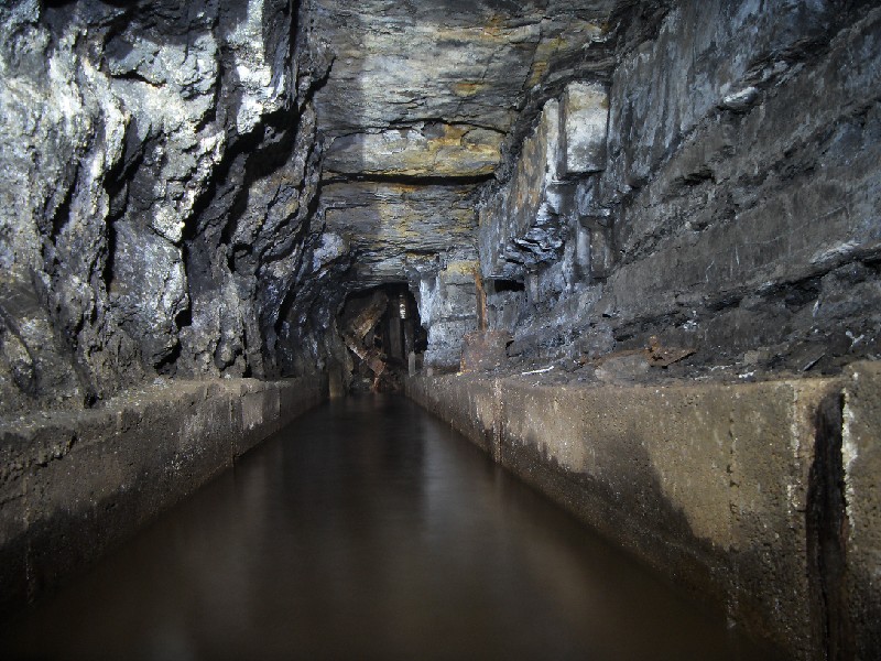 52_bs_concrete_chan3.jpg - Part of the concrete channel for the water spillway from the Brewery Shaft installation. Looking towards the water wheel.