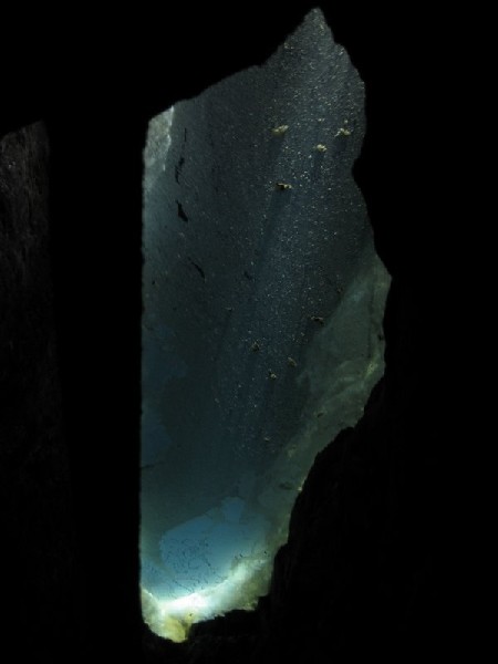 Img_5231.jpg - A hole in the passage floor, gives a view into the flooded level below.