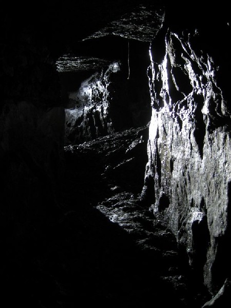 IMG_5824.JPG - Crosscut between two stopes and the tail of a rope in a rise.