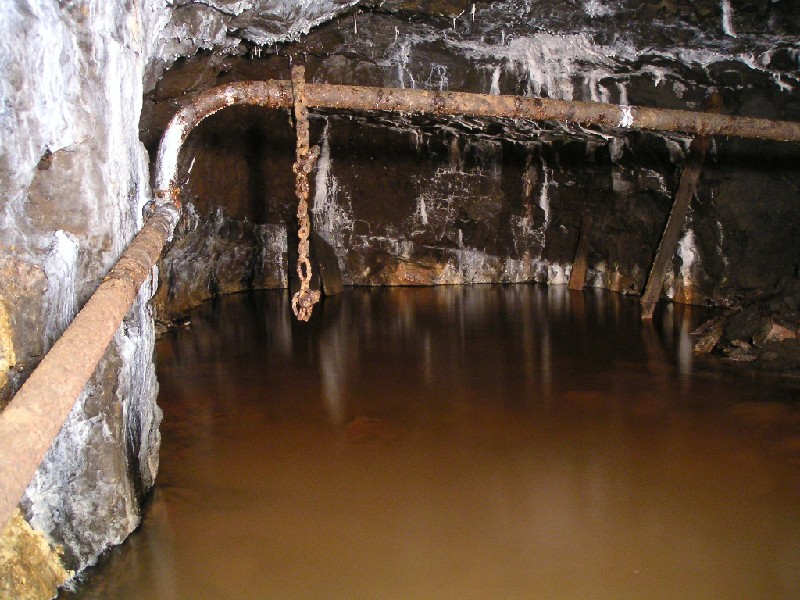 nbh_under_bhengineroom1.jpg - The side chamber underneath the collapsed shaft from behind the engine room above. This whole area smelt of oil.