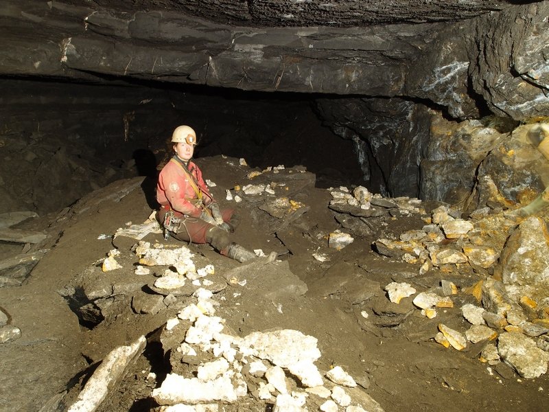 P4290388.JPG - Living in a mineral collectors paradise. Sally is sat on a section of roof. Brownley Hill West High Cross Vein.