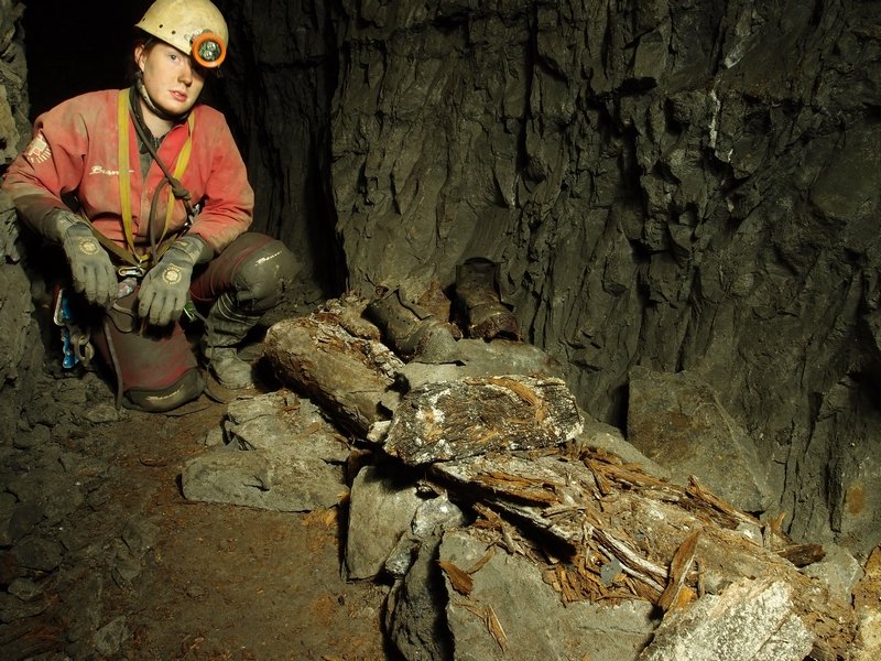 P4290394.JPG - Clogs and powder tin in a sublevel in the stopes.