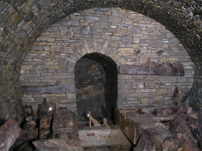 bh_compfrontwall2.jpg - A view of the front wall of the house. The stone work is very fine and as can be seen there are many artifacts.