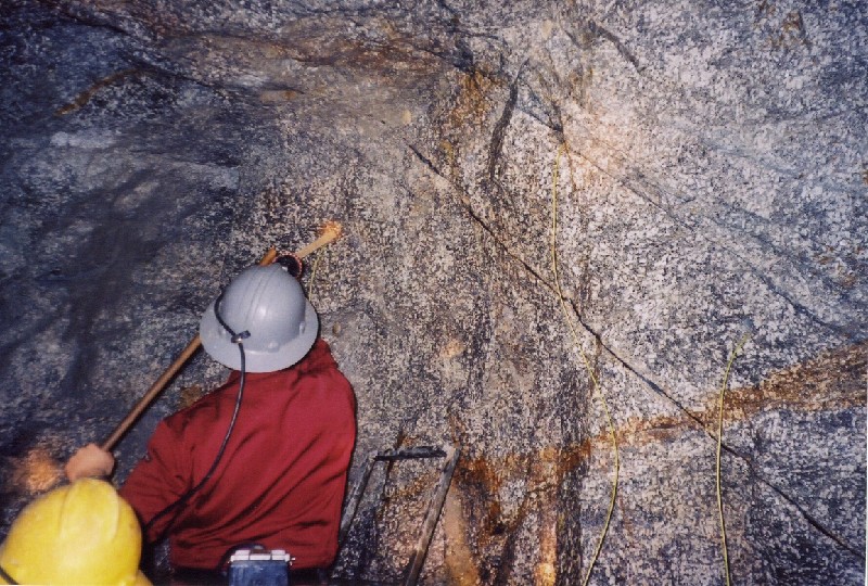 camborne5.jpg - Loading the round. I cannot remember exactly, but I think there was about 10 holes with 3 to 4 200g sticks of gelignite in each hole.