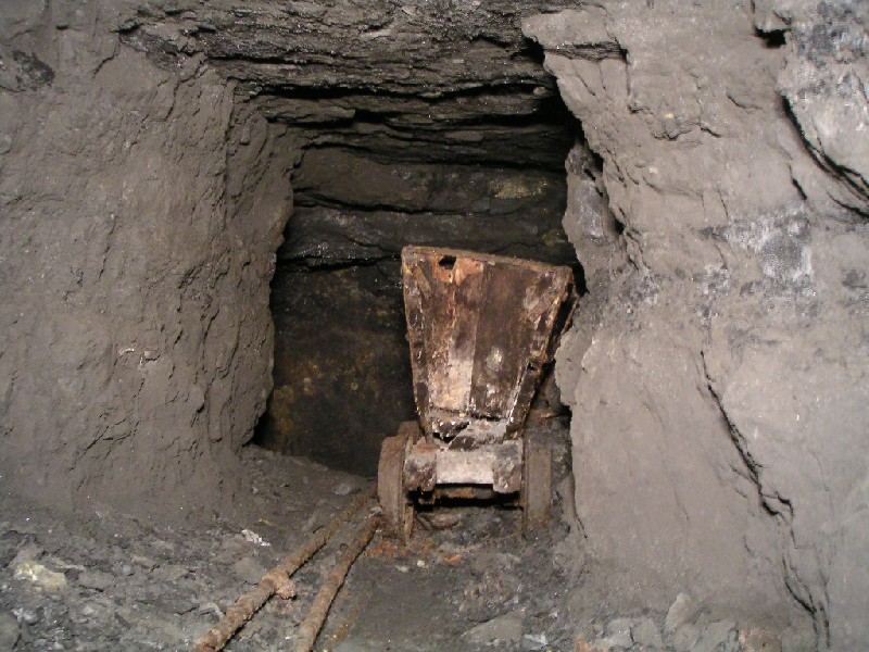 cc_mcnv_stope_oretruck1.jpg - An ore truck on the edge of a little flat off and above the main stope.