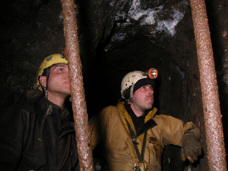 cc_mcnv_stope_shaft_watching.jpg - Peter and Alistair sat in the alcove watching Karli put in the traverse line.