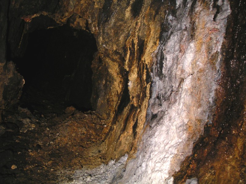cc_mcnv_stope_xc_formation.jpg - Ochre and calcite formations in the cross cut from the other side of the shaft.