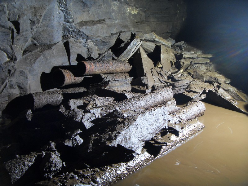 17_cchl_mcnv_pipes1.jpg - Stack of pipes in the crosscut.