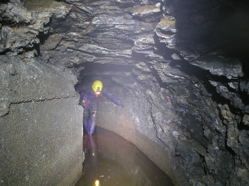 cch_concrete&rock_pass2.jpg - Past the first collapse, back into the passage. Typical VM concrete arching.