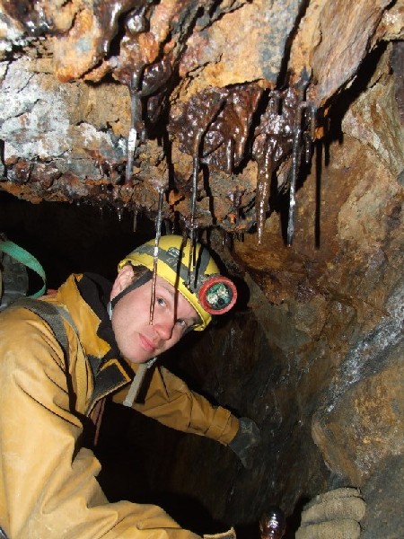 DSCF9166.jpg - Some very dark stalactites. Photo by Paul.