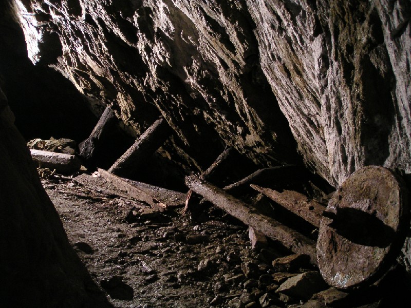 24_barrowwhe@taylors2.jpg - Down on Taylor's Level, a ledge, barrow wheel and more deep stoping greet us.