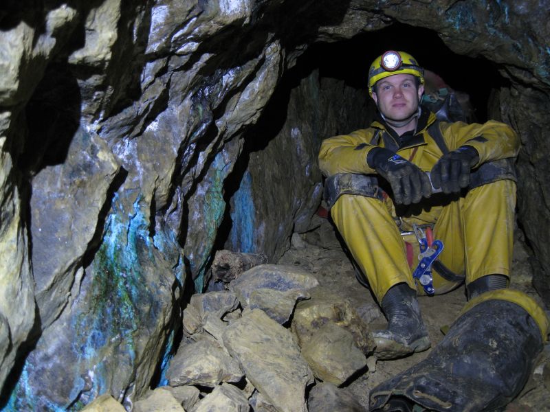 18_level_1stpitch_pete.jpg - Taking refuge in the short passage from falling rocks whilst everyone abseils down.