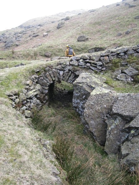 16_thriddlewaterrace3.jpg - The water race passing under the incline to fill a small pond, which in turn ran the water wheel.