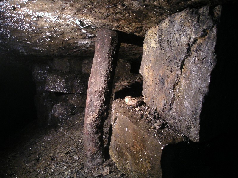 n4_workface_dynamite4.jpg - Pillar and dynamite remains.