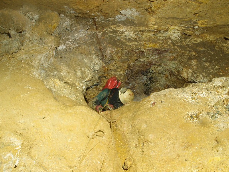 P6143325.JPG - Sal climbing up into the stope above the 50' Level.