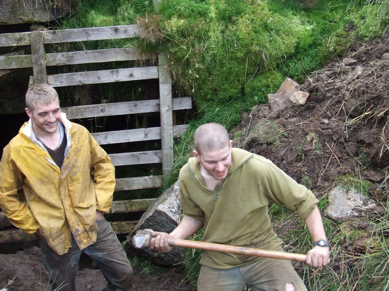DSCF2066.jpg - Students cracking stone slabs.