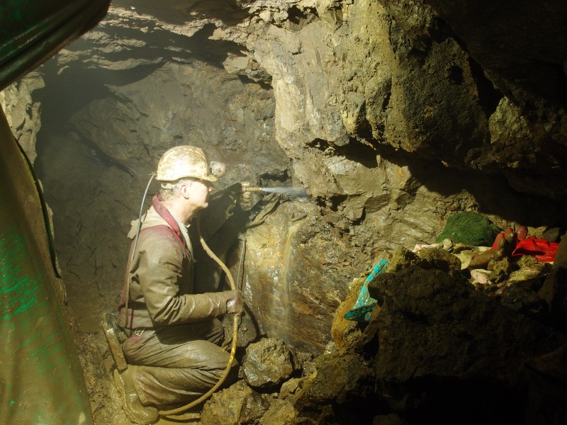 P1122340.JPG - Pete washing out a cavity.