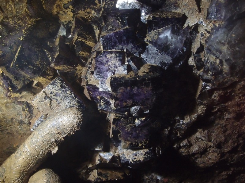 P1122406.JPG - Fluorite cubes in the roof. Gloved finger width 25mm.