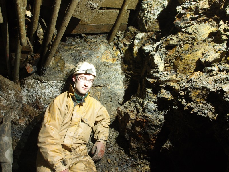 P3118444.JPG - Ben on the left hand wall at the shaft bottom.