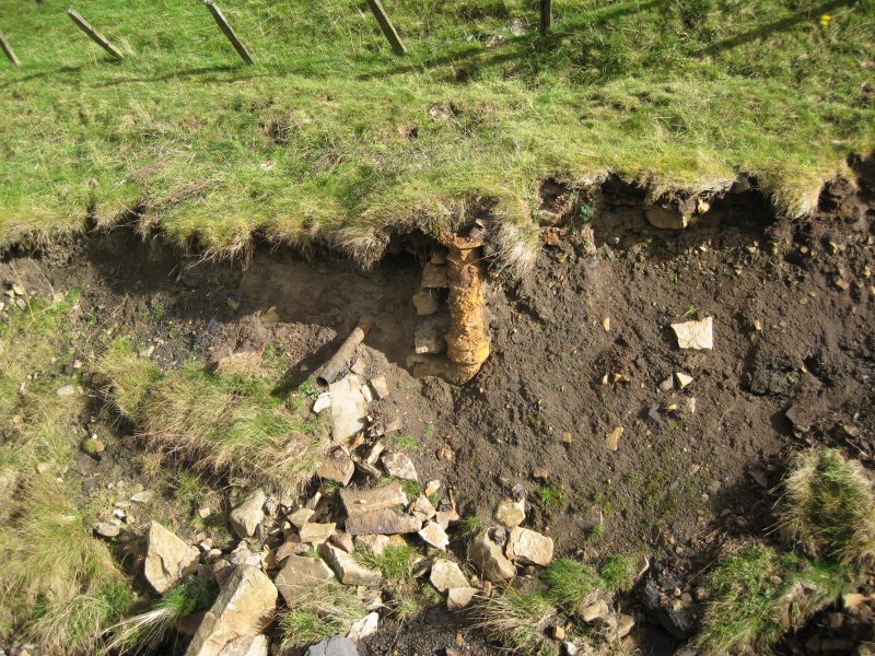 IMG_1492.jpg - A large diameter pipe in the washed away bank.