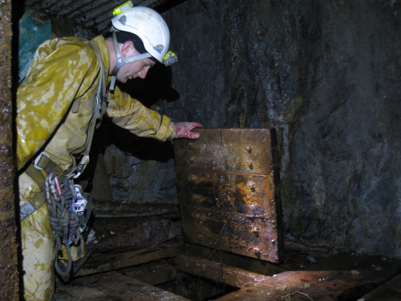 IMG_1922.jpg - Trap door into a flooded shaft.