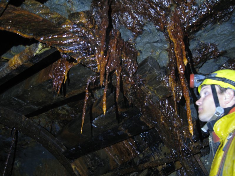 Img_3726.jpg - Iron stained stalactites.