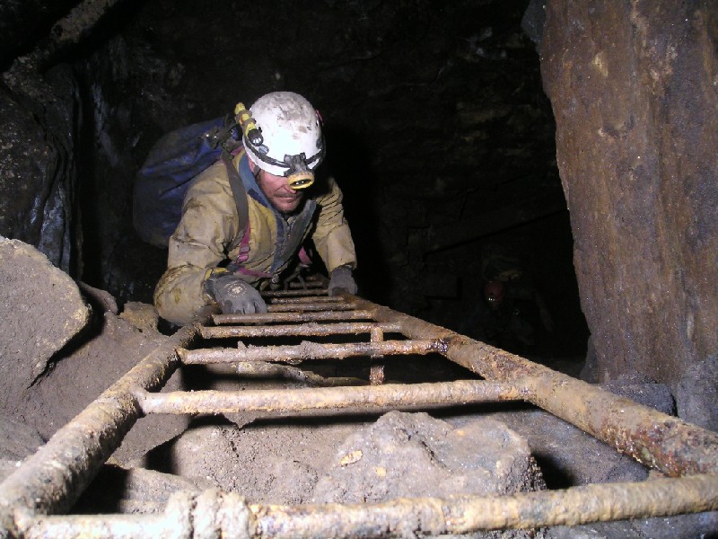 ghg_risefromhorselevel3.jpg - Decending the ladder, and view of the hole back into the horse level.