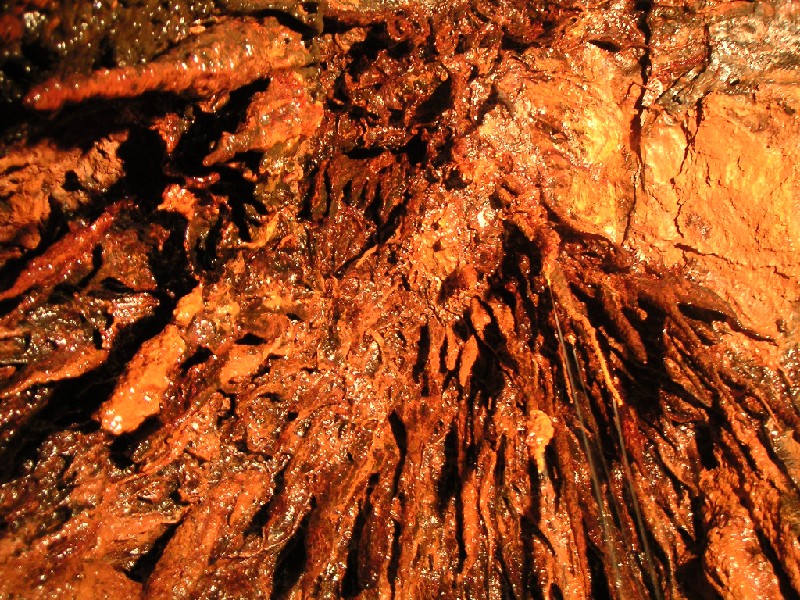 ghgl_orcheformations4.jpg - More ochre formations in the choked area of the passage.