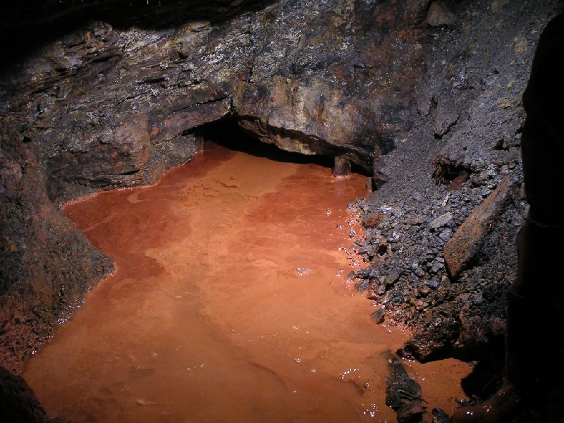 ghgl_orchepool1.jpg - End of the line, the passage goes on, but not the explorers, the timber roof support can be seen just above the ochre line.