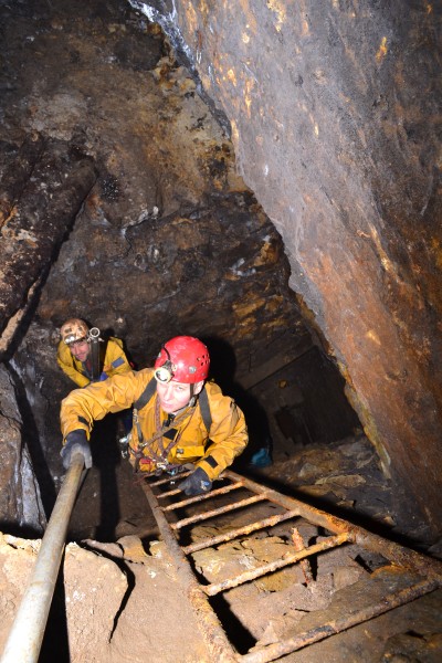 DSC_0835.JPG - Passing the scaffold poles up the ladder into the stope. Photo by Karli.