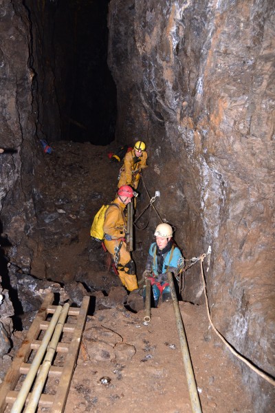 DSC_0866.JPG - Passing the poles across the traverse. Photo by Karli.