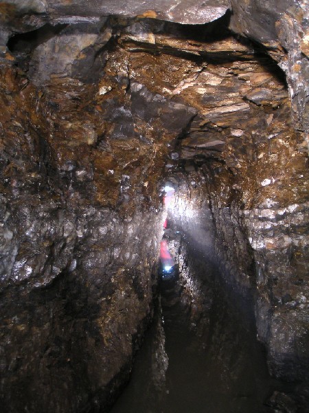mc_1sv_view_west1.jpg - The strata near to the backed up water collapse. The red is, Karl's reflection in the water.