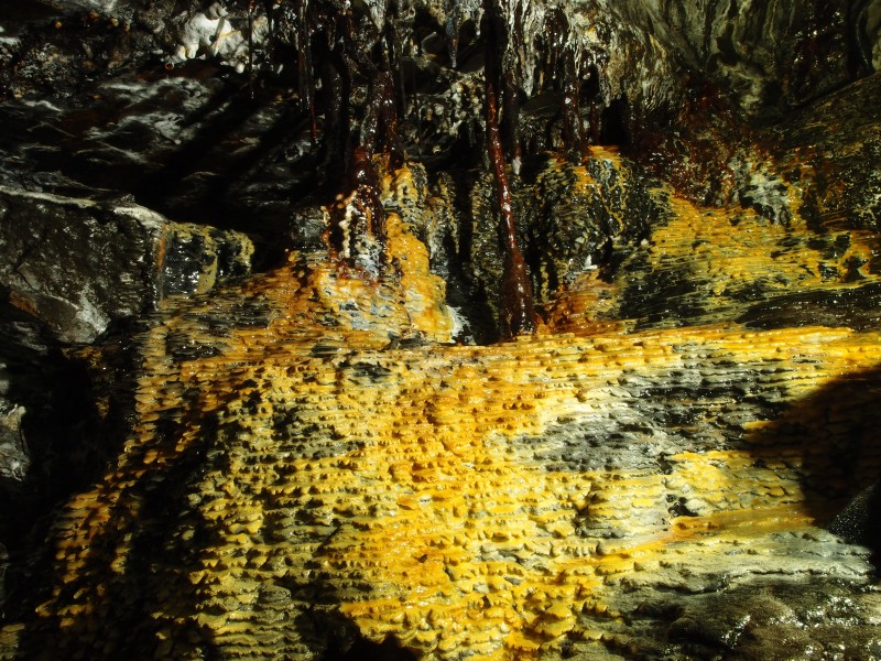 P3022600.JPG - Calcite formations at the partially backfilled passage to the sump and chamber.