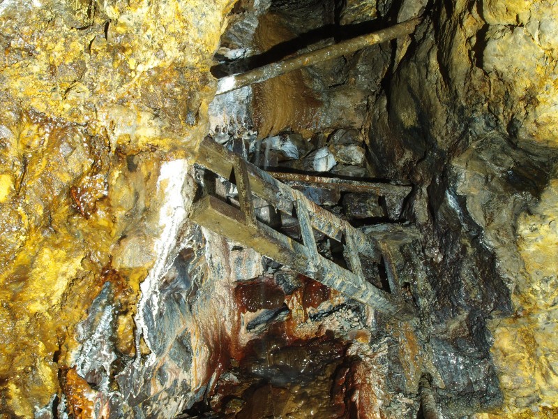 P2211945.JPG - The way on is to go up past the ladder and up the manway / rise. High Raise Vein.
