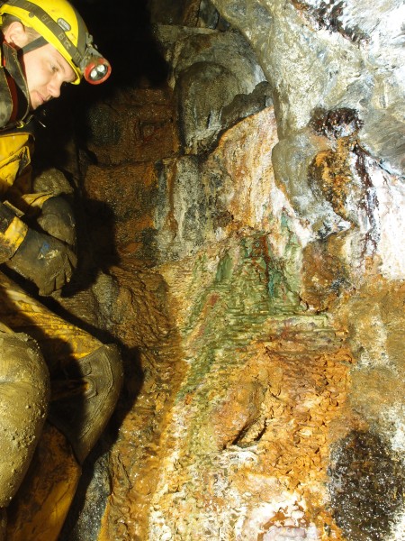 P2211978.JPG - Green calcite formations in the manway.