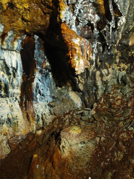 P2211985.JPG - Fantastically coloured formations in the stope below the manway.