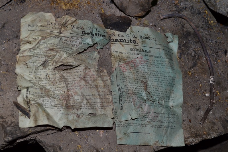 DSC_0164.JPG - Explosives instructions in English and German with piece of lead lined fuse. Photo by Karli.