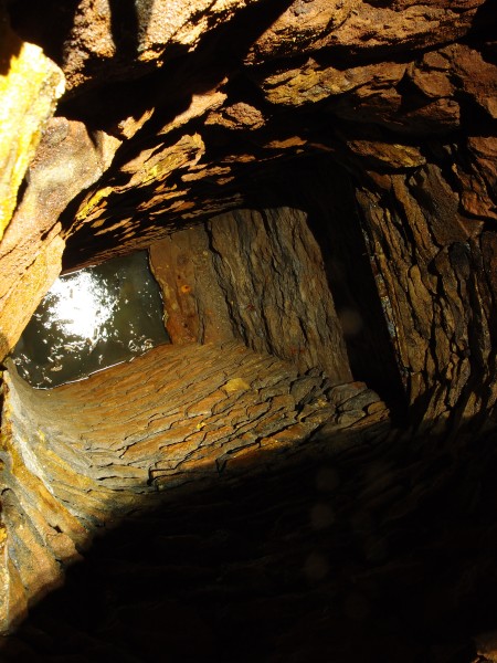 P7060855.JPG - Looking down a ore chute to the flooded level below.