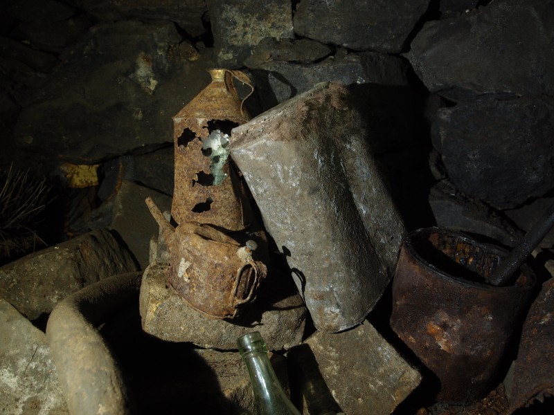 P2118020.JPG - Oil can, oil jug, and explosives tin.