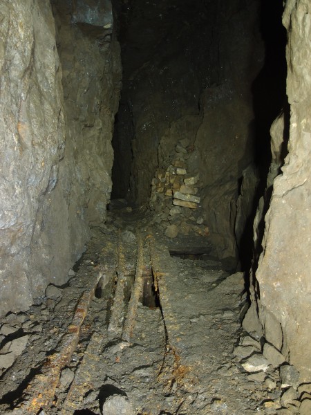 P2118090.JPG - Hopper and manway in stopes above the main level.