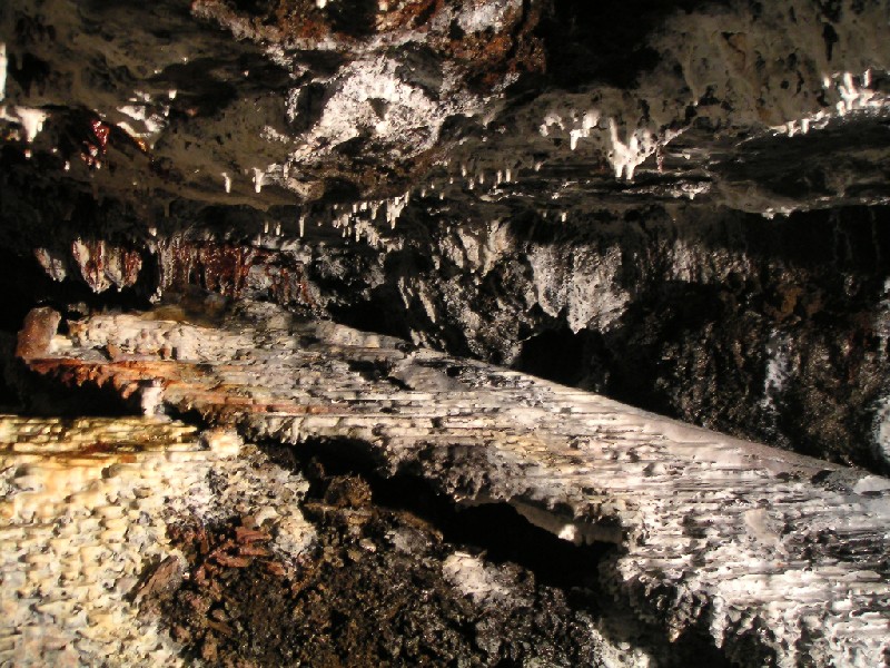 rg_hsb_calciteflows_ladder3.jpg - The calcite flow by the calcified ladder further along the Hangingshaw Branch. The first time we saw it, it looked like corrugated iron as it looks like a sheet - I wonder if under lying mud has been washed away leaving the crust?