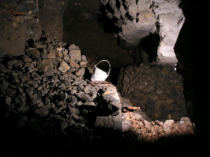 rg_psf_bucketnearwhimseyshaft.jpg - Deads walling, 'old' bucket and a barrel collar in the flats.