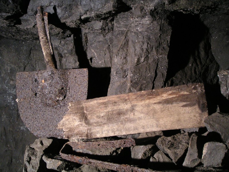 rg_psf_shovel&lid.jpg - Shovel bottom and what looks to be a lid to a box. It has writing on it but it was very difficult to see it.