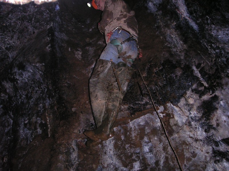 sb_abseiltosublevel1.jpg - Karl coming down the shaft. It led into a small workings that we had an explore off. You have to swing in to land as the shaft carries on into a sump, and possibly a passage.