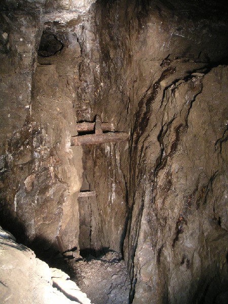 rg_stopeabove_hardshinsvein.jpg - Further into the flats we entered this area of stoping. Here we found the tops of a few rises that we think may have coincided with the collapse in the horse level below. We did not explore further here as time was pushing on.