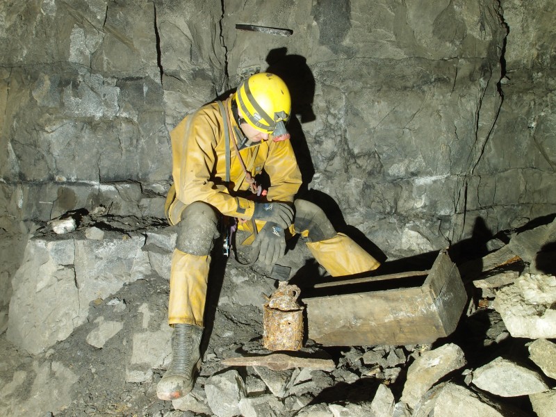 PB081480.JPG - Explosives box, can and pick head.