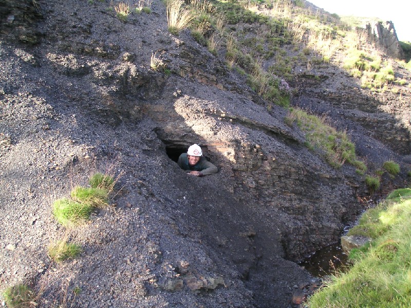 fs_2nd_entrance3.jpg - Ambrose crawling out of the new hole.